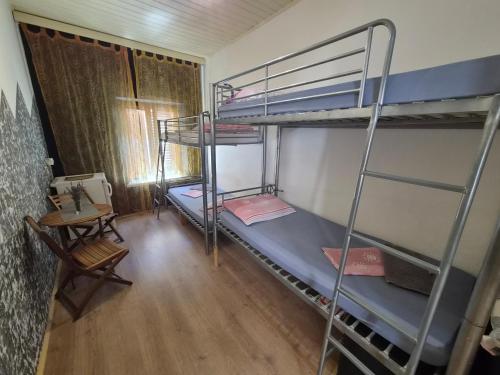 a room with two bunk beds and a table at Hvar old Town Boutique in Hvar