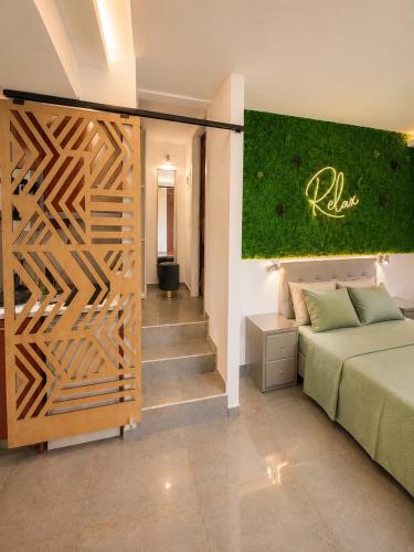 a bedroom with a wooden partition with a bed in it at THEASIS 5 luxury studio with sea view in Neos Marmaras