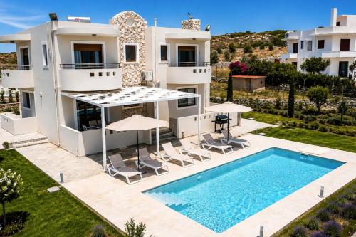 an image of a villa with a swimming pool at Villa Kallithea Sunrise in Koskinou