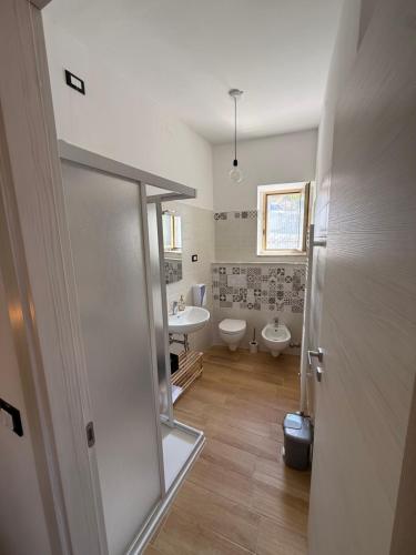 a bathroom with a toilet and a sink at Agrialloggio Supramonte in Barisciano