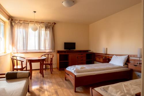 Llit o llits en una habitació de Posticum Guesthouse