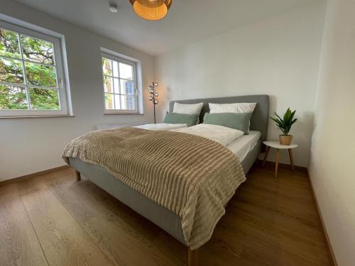a bedroom with a large bed in a room at Soul Apartment in Aalen