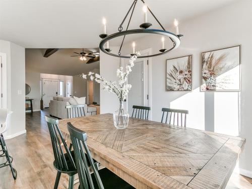 a dining room and living room with a table and chairs at New Dream Home in Broken Arrow! in Broken Arrow