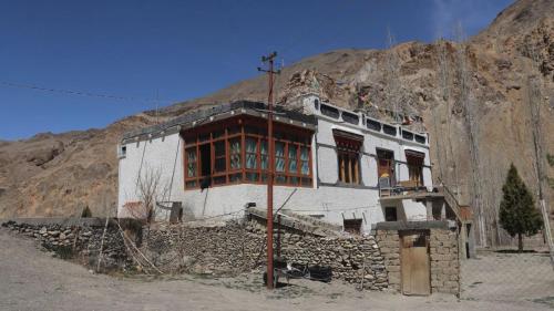 a building in the middle of a mountain at Wanla Eco Residence in Tarklak