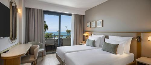 a hotel room with a bed and a desk at Side Star Beach Hotel - Ultra All Inclusive in Side