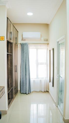 a room with a window with a bed in it at The Ace Hotel in Lusaka