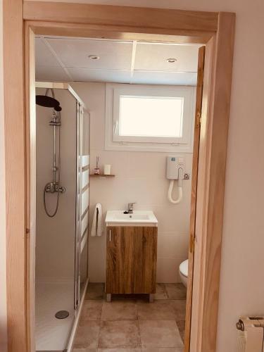 a bathroom with a sink and a shower at Villa Horta in Horta