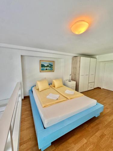 a bedroom with a large bed in a room at APARTMENT Alessio in Interlaken