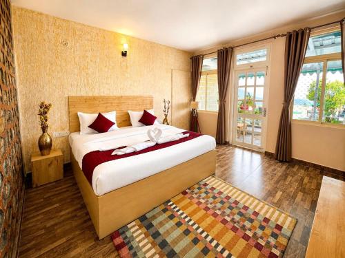 a bedroom with a large bed in a room at The Hills Boho in Mukteshwar
