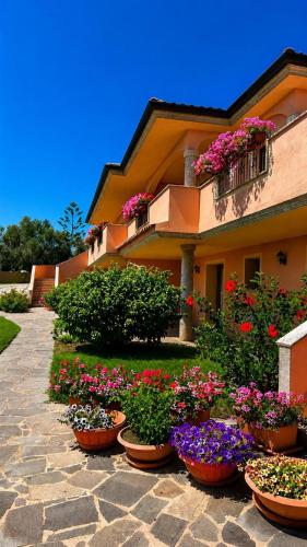 a group of flowers inront of a building at Stella Marina in Olbia