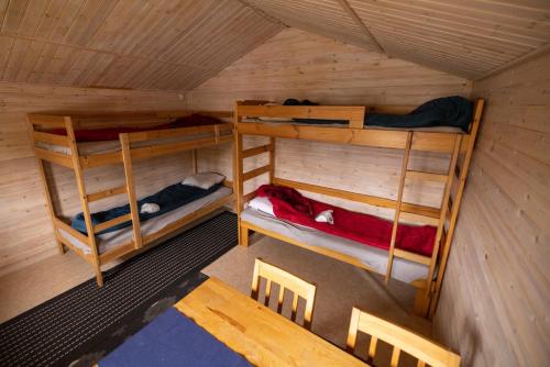 an overhead view of a room with two bunk beds at JVT Cabins in Kiruna