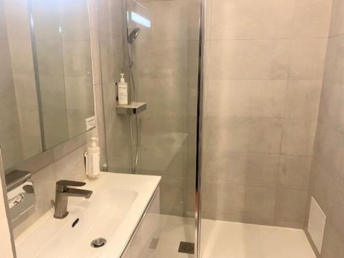 a bathroom with a shower and a sink at Villa Borghese, The Originals Relais in Gréoux-les-Bains