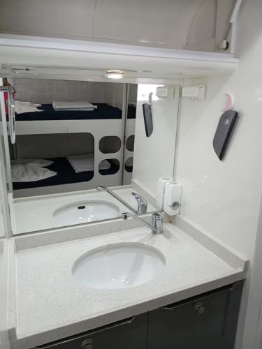 a bathroom with a sink and a mirror at Casa de Família Coração Amazônico in Alter do Chao