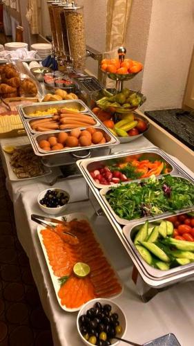 a buffet line with many different types of fruits and vegetables at Hotel Restaurant Freihof in Oberharmersbach
