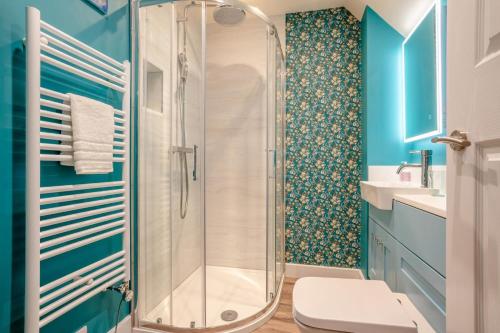 a bathroom with a shower and a toilet and a sink at 2 Bed in Leyburn oc-n41362 in Leyburn