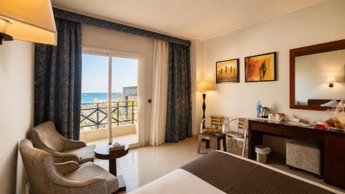 a hotel room with a view of the ocean at Elysees Dream Beach Hotel-By AMARINA Hotels & Resorts in Hurghada