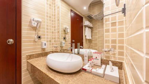 a bathroom with a white sink and a mirror at Elysees Dream Beach Hotel-By AMARINA Hotels & Resorts in Hurghada