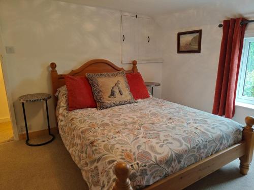 a bedroom with a bed with red pillows at 2 Bed in Partney oc-v44757 in Partney
