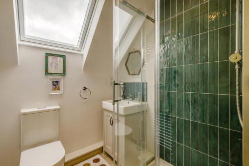 a bathroom with a shower and a toilet and a sink at 2 Bed in Docking oc-t44851 in Docking