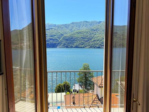 a view of a lake from a window at Cristoforis Lake View House in Carate Urio