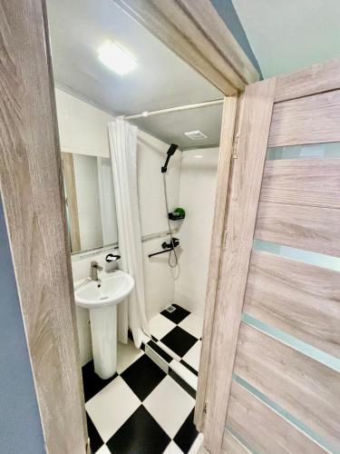 a bathroom with a sink and a mirror and a toilet at Hayq in Yerevan