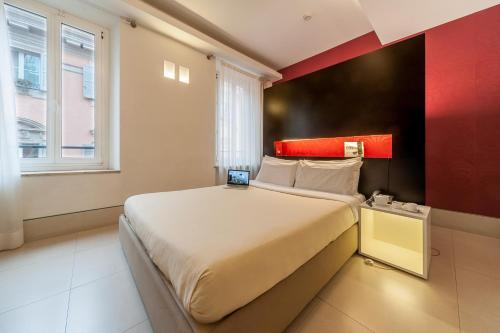 Postel nebo postele na pokoji v ubytování Savoy Hotel