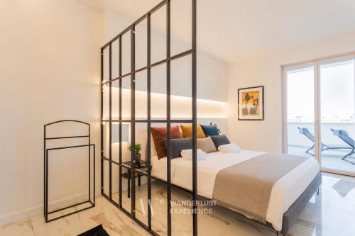 a bedroom with a bed with a large glass wall at Wanderlust Experience Zenith Rooftop in Bitonto