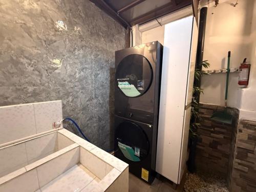 a small room with a water dispenser in a kitchen at Los Ausoles Home with Jacuzzi, HotSprings Ahuachapán in Ahuachapán