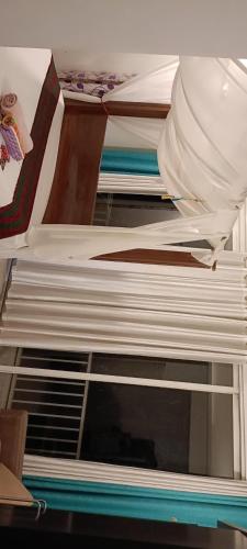 a stack of bunk beds in a room at Casa Branca in Siolim