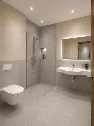 a bathroom with a shower and a toilet and a sink at Residenz Bergkristall in Saalbach-Hinterglemm