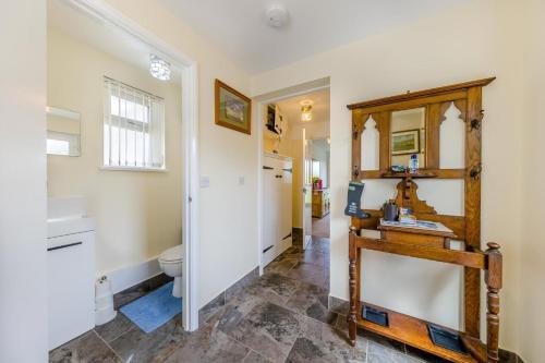 a bathroom with a sink and a mirror at 3 Bed in Brecon oc-bn363 in Brecon