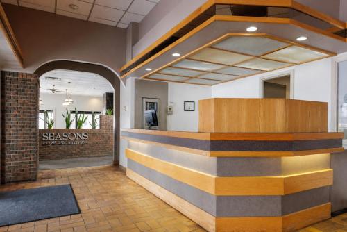a lobby with a striped wall in a building at Heritage Inn Hotel & Convention Centre - Taber in Taber