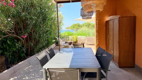a blue table and chairs on a patio at Villa Edo Cefalù in Cefalù