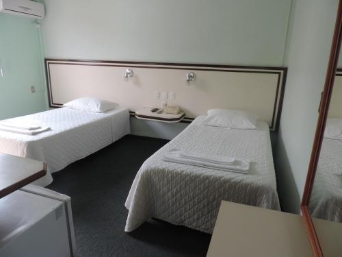 
A bed or beds in a room at Hotel Demarchi
