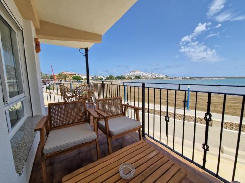 a balcony with chairs and a view of the beach at Villa Brisamar - On the beach in Peniscola