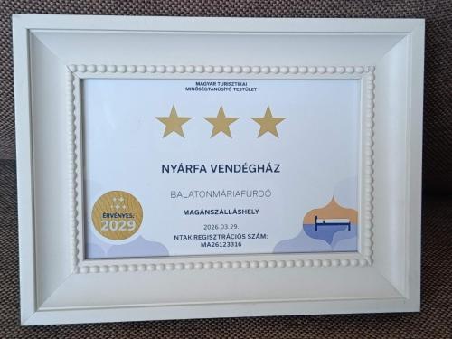 a framed diploma frame with a picture of five stars at Nyárfa Vendégház in Balatonmáriafürdő