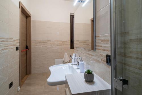 a bathroom with a sink and a shower at ISA ROOMS Bed&Breakfast in Bovalino Marina