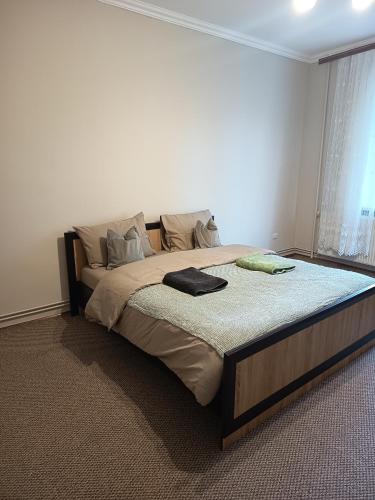 a bedroom with a large bed in a room at Comfort place in Ternopil