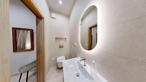 a white bathroom with a sink and a mirror at Lobster Room - Estrela do Mar - 1 in Albufeira