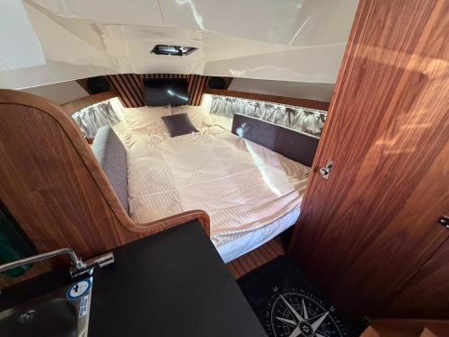 a small bed in the back of a boat at Golden Yacht Solina in Polańczyk