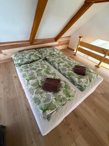 a large bed sitting on the floor in a room at Tarasova in Zbudský Rokytov