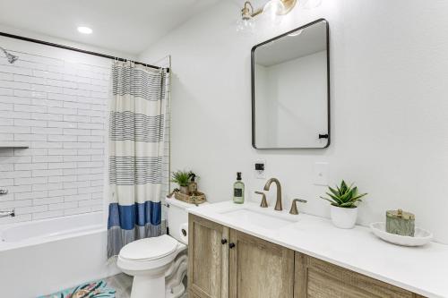a bathroom with a sink and a toilet and a mirror at Steinhatchee River Hideaway, 1 Mi to the Water! in Steinhatchee