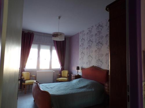a bedroom with a bed and a window at Mag's Dream in Berck-sur-Mer