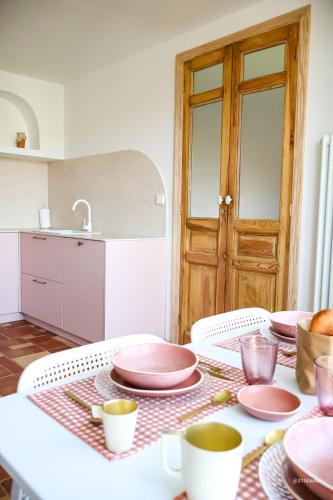 a kitchen with a table with plates and cups on it at Alazne Enea in Bermeo