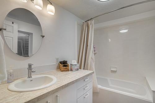 a bathroom with a sink and a mirror at Utah Valley Basecamp: Apt for Hikers & Explorers! in Spanish Fork