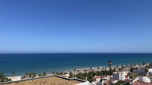 a view of the beach and the ocean at BLUE OASIS Mojácar in Mojácar