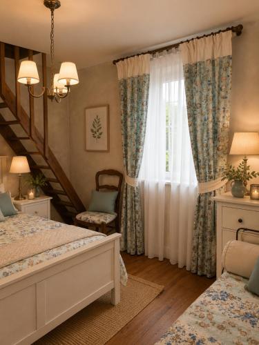 a bedroom with a bed and a window at Le CLOS D'ETRETAT in Les Loges