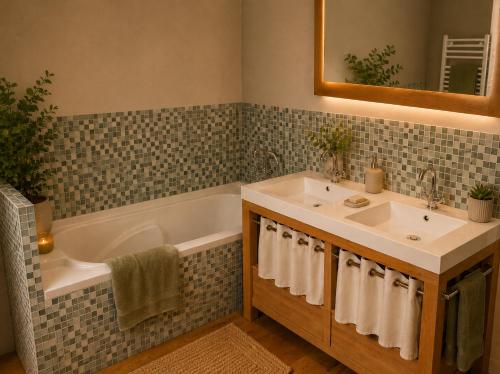 a bathroom with a sink and a bath tub at Le CLOS D'ETRETAT in Les Loges