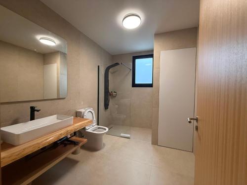 a bathroom with a sink and a toilet and a shower at Terra Vivaz - Porto Bay Formosa in Porto Formoso