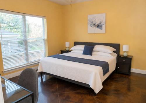 a bedroom with a large bed and a large window at Ground Floor, 3BR, Free Parking, Near Refinery -E- in Moss Point
